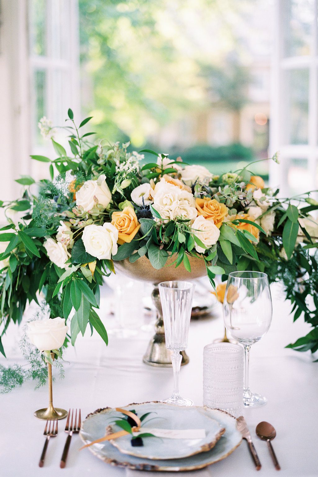 Fine Art cascading centerpiece by The Blue Daisy Floral Designs. Photographed by Lauren Renee Photography.