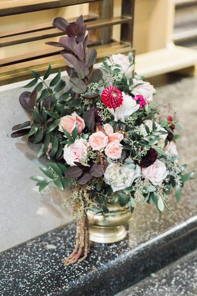 church wedding ceremony flowers in gold urn