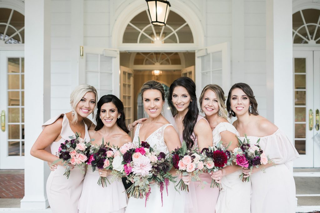 Bride with bridesmaids fall wedding bridal party outdoor portrait