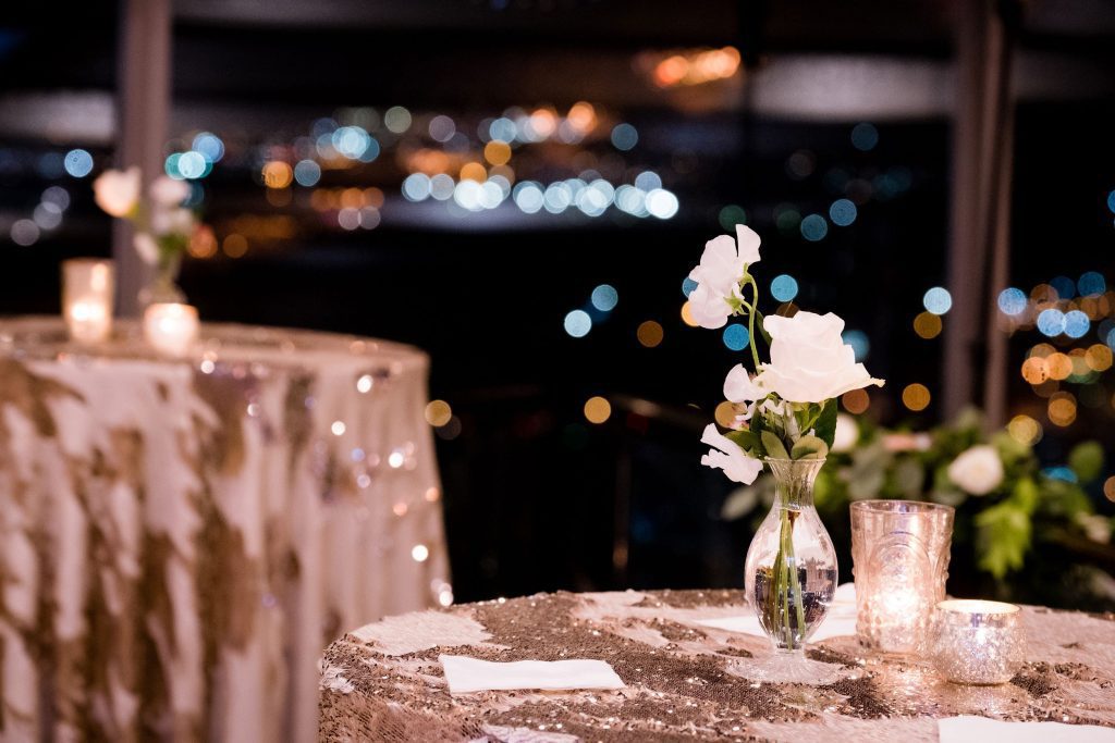 winter wedding cocktail hour tables floral bud vases candles romantic