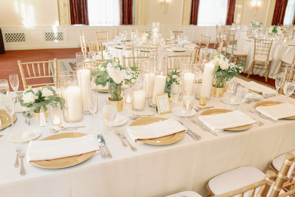 Grand Ballroom wedding reception long guest table centerpieces