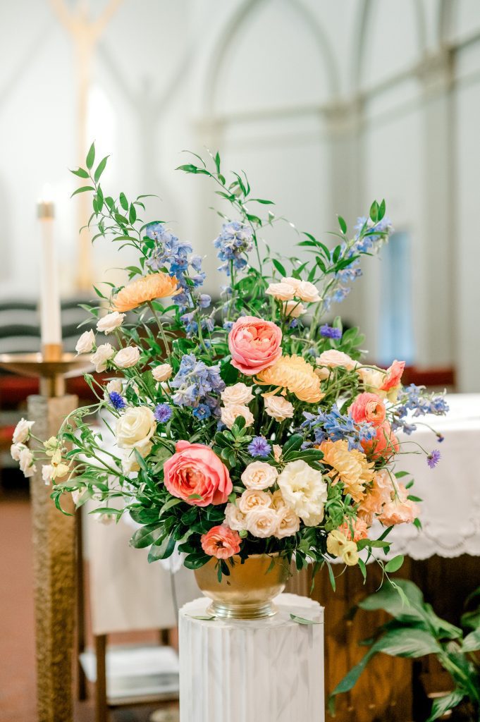 colorful textural summer wedding ceremony flowers in gold compote