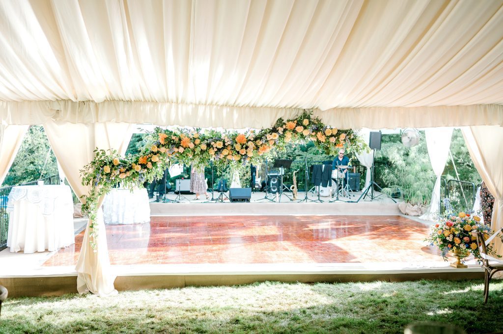 summer garden party wedding dance floor entrance custom floral decor