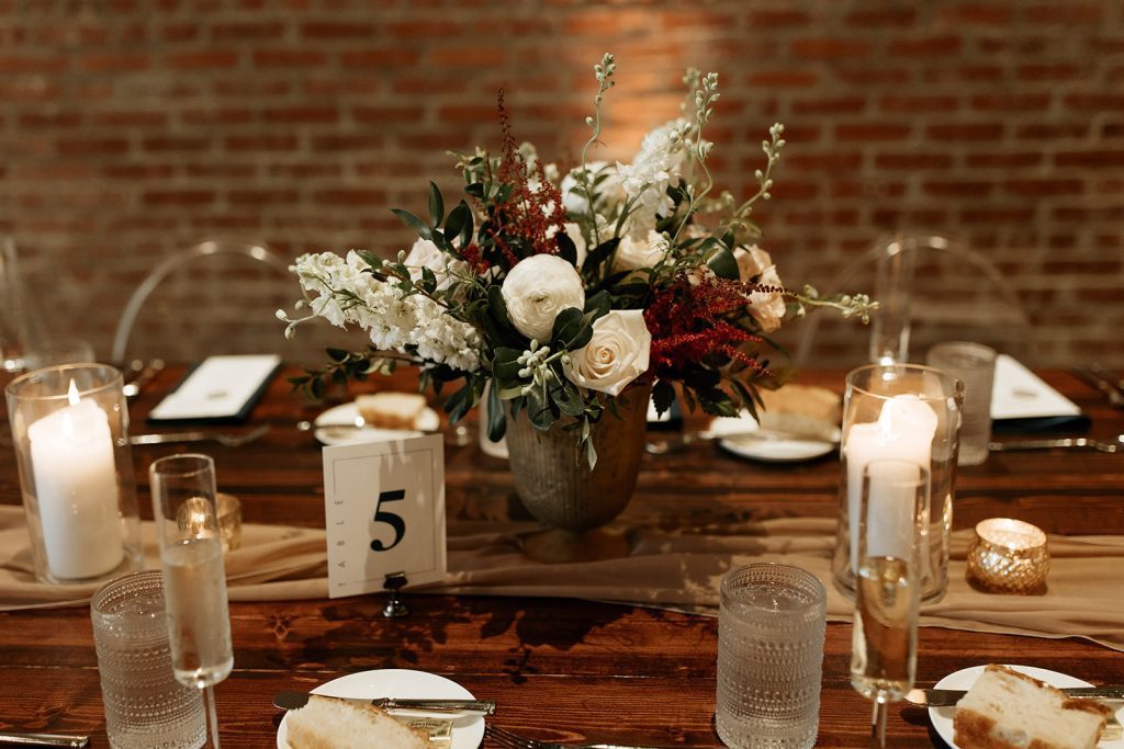 modern industrial romantic wedding reception table low centerpiece