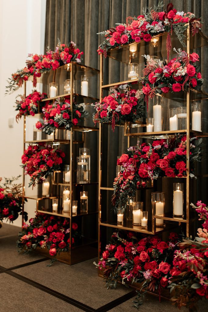 modern glamorous wedding ceremony backdrop custom shelves with floral and candles