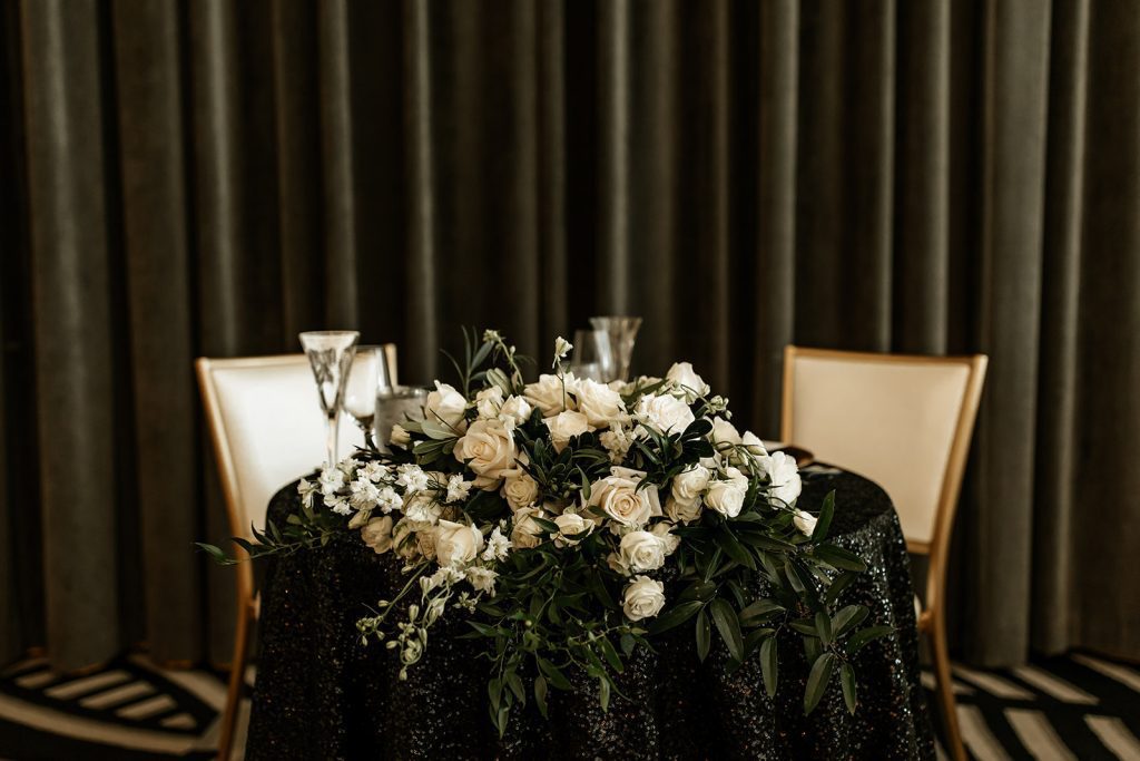 modern glamorous wedding sweetheart table floral design