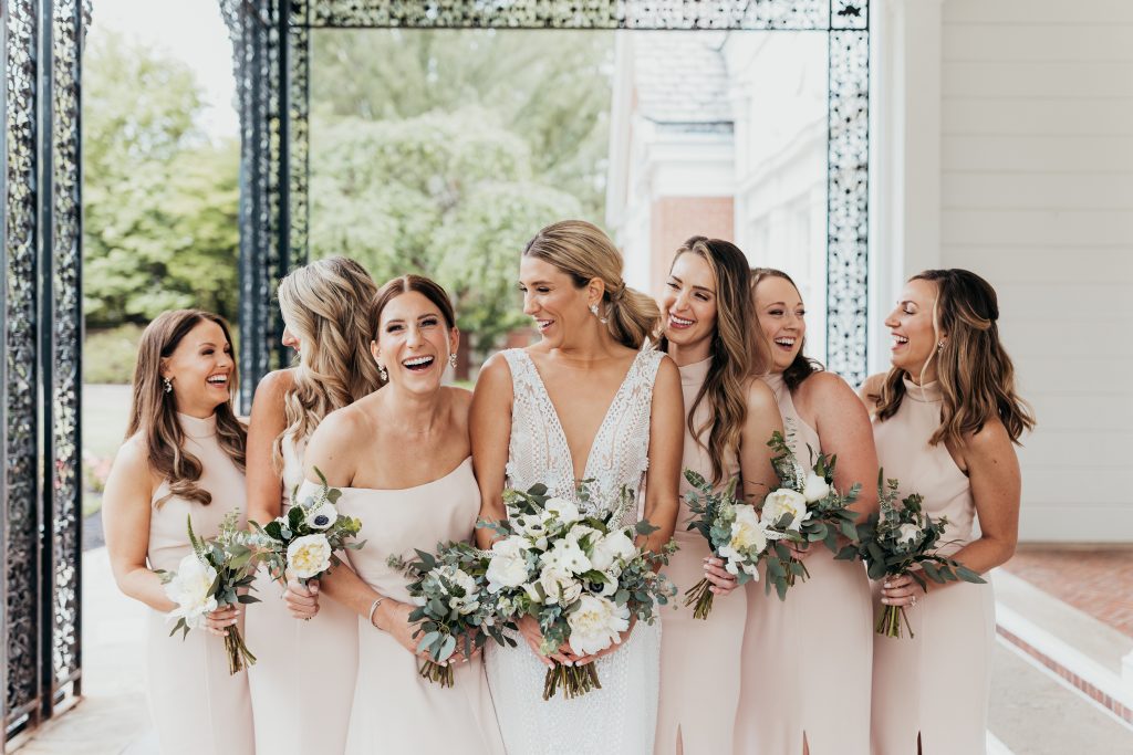 Bride and bridesmaids wedding bridal party outdoor portrait