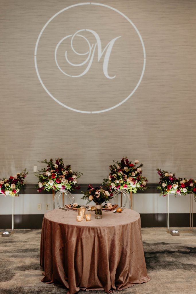 sweetheart table custom lighting monogram floral backdrop Fairmont Hotel Pittsburgh wedding reception