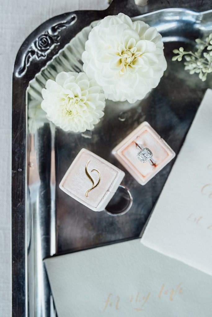 white dahlia wedding details flatlay