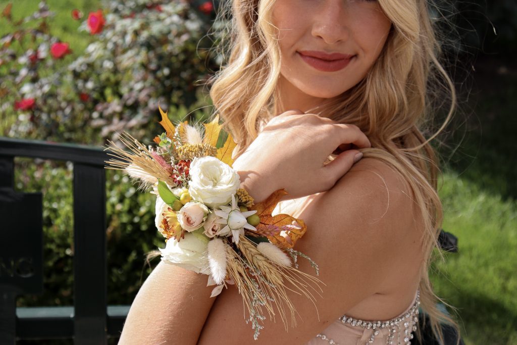 Homecoming flowers wrist corsage fall textures on gold cuff bracelet