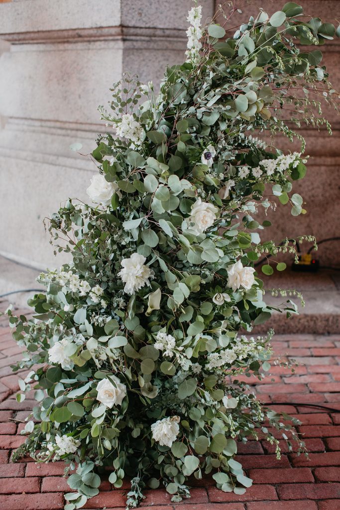 outdoor wedding ceremony at The Pennsylvanian floral and greenery pillar