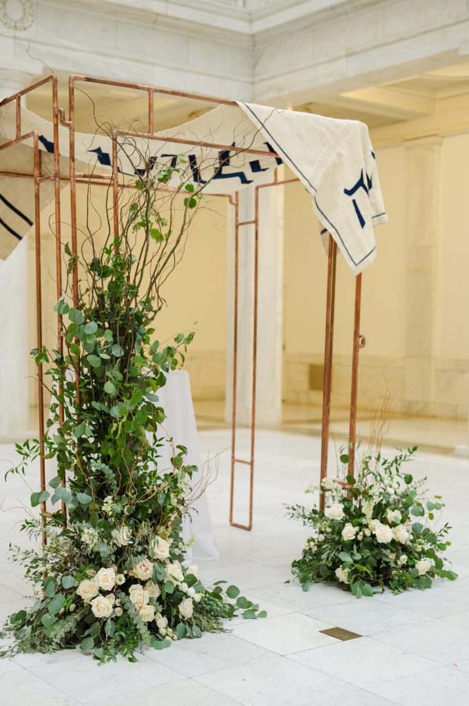 Jewish wedding ceremony Chuppah Greenery and white flowers Carnegie Museum Hall of Sculpture Pittsburgh