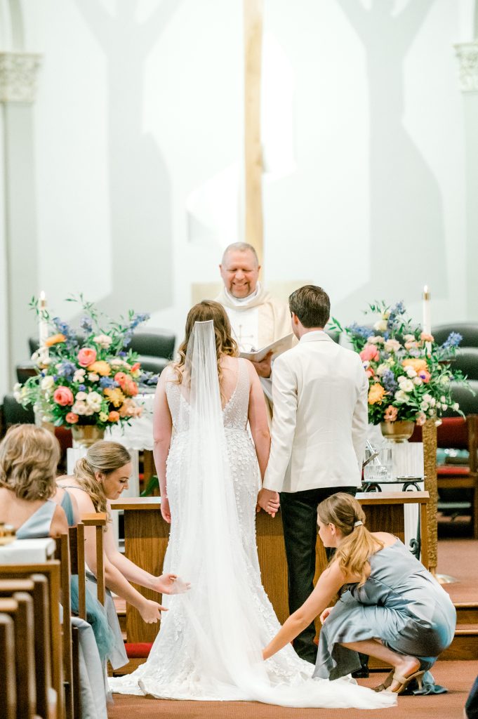church wedding ceremony with colorful altar arrangements